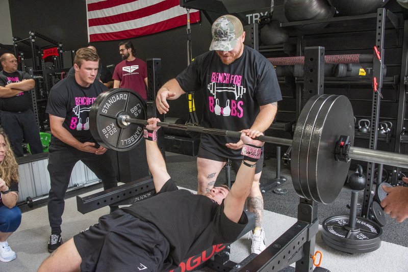 Local trainer Cameron Horn presses 315 pounds.
